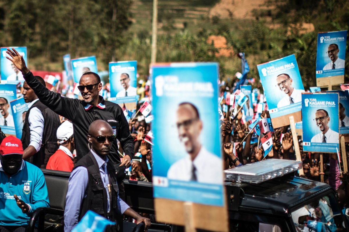 Incumbent Rwandan President Paul Kagame (L) greets a crowd of supporters as he arrives for a campaign rally on July 31, 2017 in Gakenke ahead of August 4 presidential election. Kagame and his Rwanda Patriotic Front (RPF) party have held an iron grip on power since overthrowing the extremist Hutu regime, which perpetrated the 1994 genocide of 800,000 Tutsis.