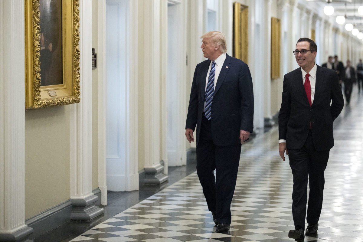President Donald Trump and Secretary of the Treasury Steven Mnuchin walk to a meeting on April 21st, 2017.