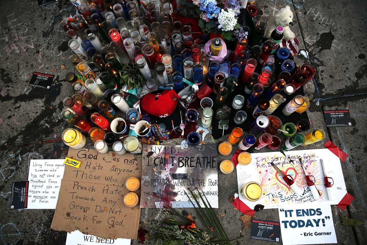 A growing memorial for Eric Garner near where he died after he was taken into police custody in Staten Island on July 22th, 2014, in New York City.