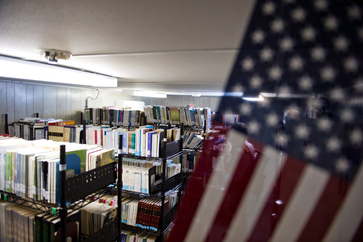 This photo reviewed by the U.S. military and made during an escorted visit shows bookshelves in the detainee library in Camp Echo detention facility in Guantanamo Bay, Cuba, on April 9th, 2014.