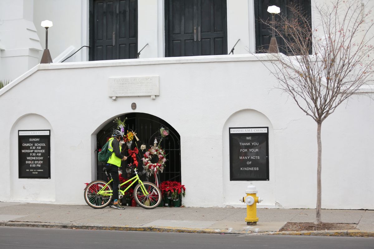 A man stops to observe the makeshift memorial in front of Mother Emanuel AME Church in downtown Charleston, South Carolina, on January 4th, 2017.