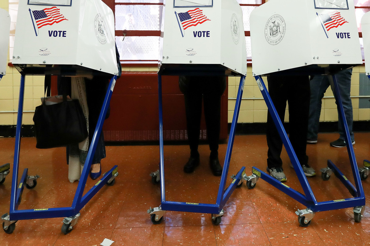 Voters cast their ballots at voting booths in New York City, New York.