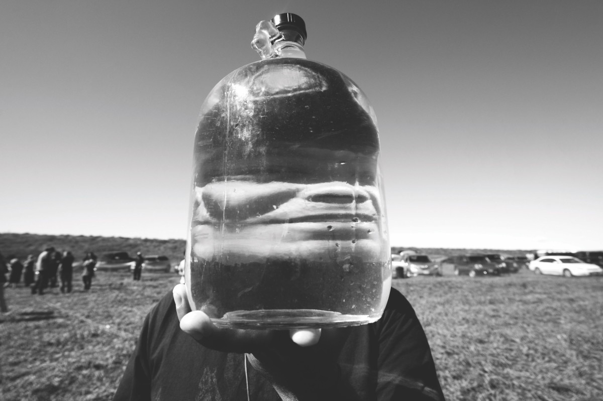 A jug of purified water, reinforcing the ongoing role of the Water Protectors.