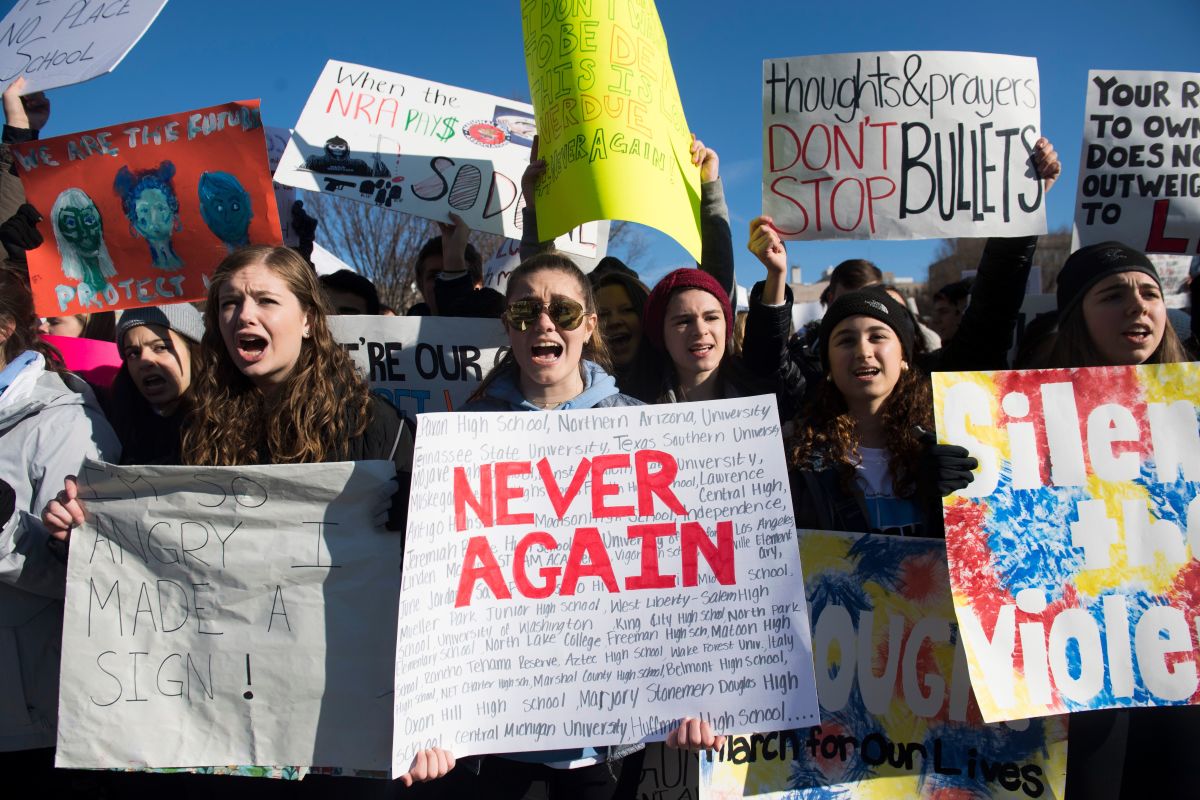 Students protest with signs demanding tighter gun control legislation front the White House in Washington, D.C.