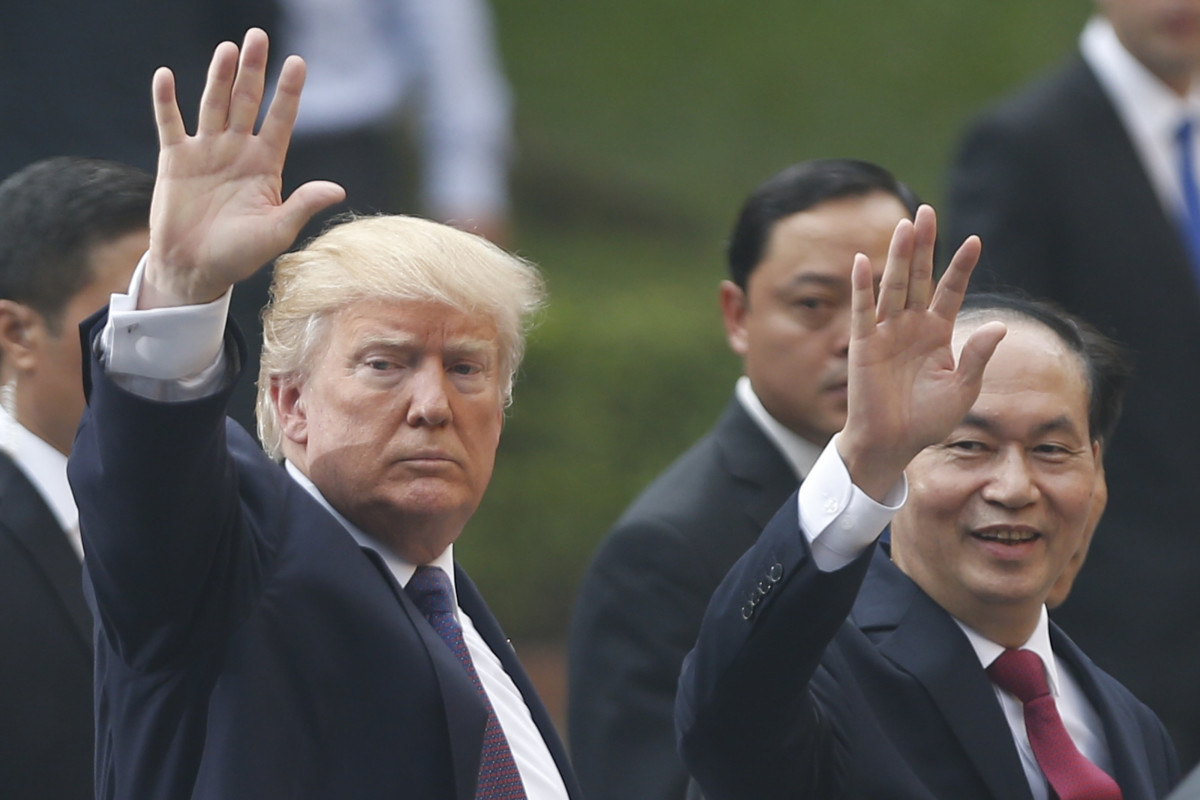 President Donald Trump and Vietnam's President Tran Dai Quang leaves a press conference at the Presidential Palace in Hanoi on November 12th, 2017.