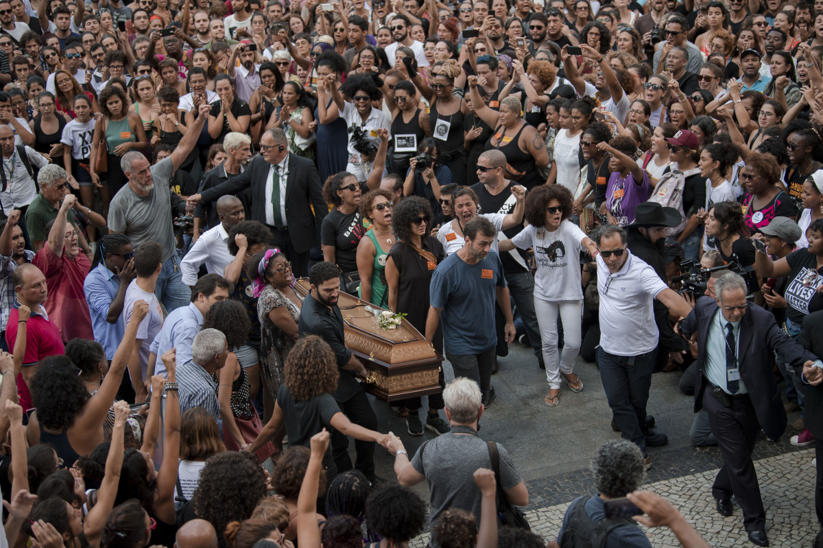 Politicians, friends, and relatives carry the coffin of slain Brazilian councilwoman and activist Marielle Franco during her funeral at Rio de Janeiro's Municipal Chamber in Brazil.