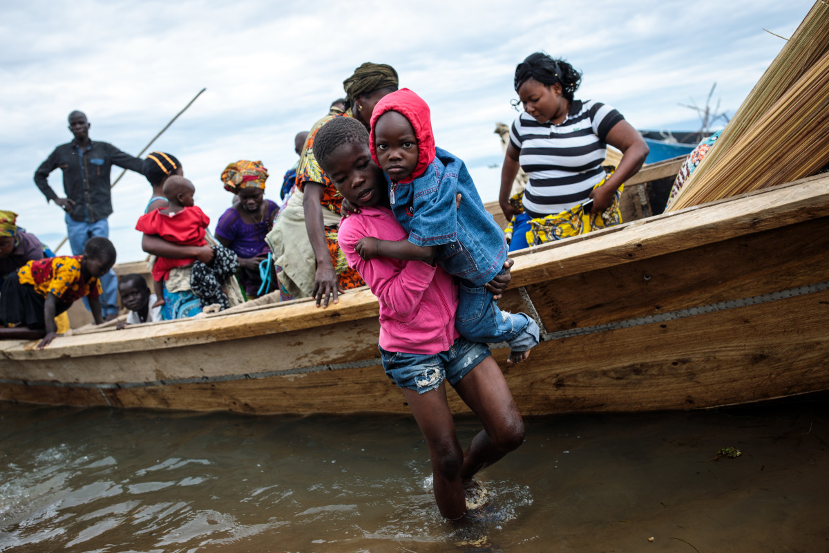 Refugees from Tchomia in the Democratic Republic of Congo arrive on boat at the Nsonga landing site on April 9th, 2018, in Nsonga, Uganda.