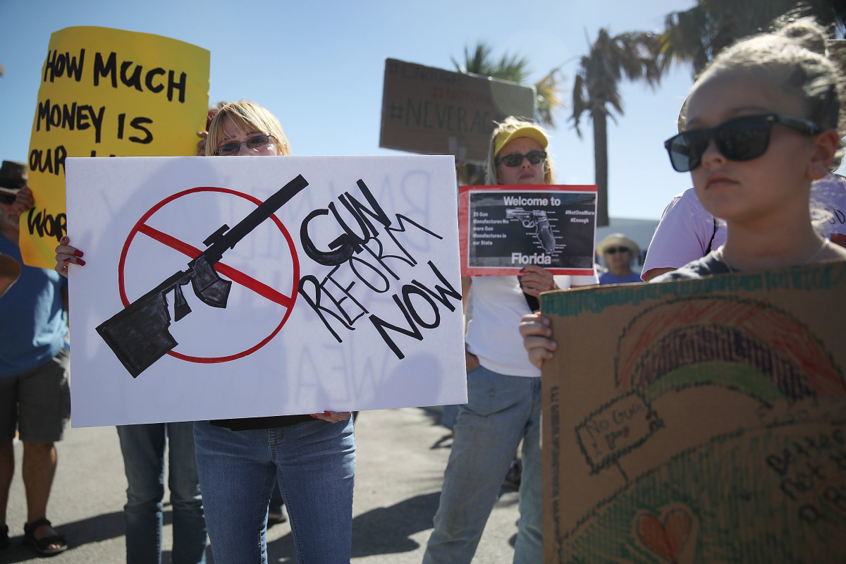 Activists protest in front of Kalashnikov USA, a gun manufacturer that makes an AK-47 rifle, on February 25th, 2018, in Pompano Beach, Florida.