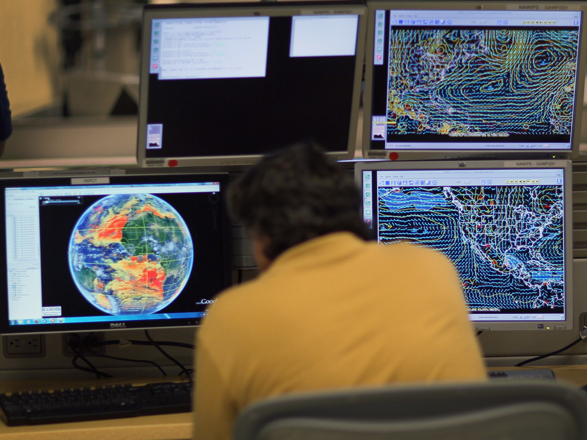 Senior hurricane forecaster Jack Beven studies computer models as he tracks Tropical Storm Arlene at the National Hurricane Center.