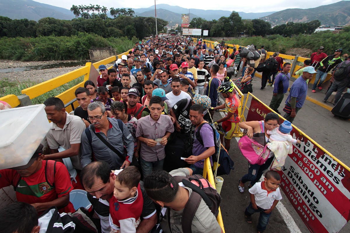 Venezuelan citizens cross the Simon Bolivar international bridge from San Antonio del Tachira in Venezuela to the Norte de Santander province of Colombia.