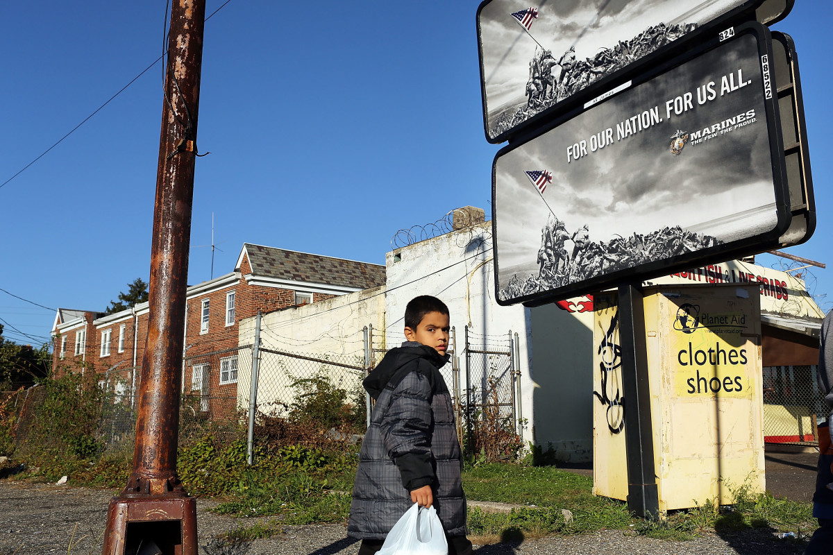 A child walks down a street in Camden, New Jersey.