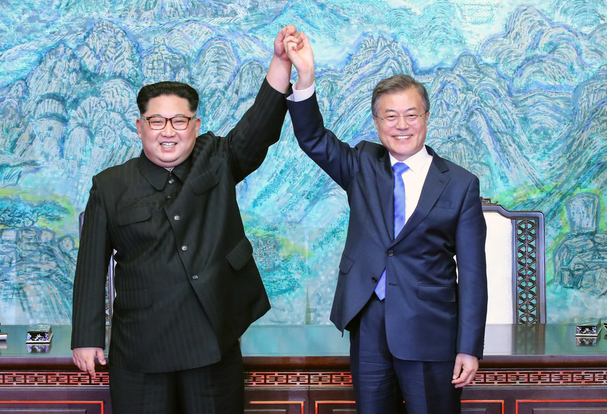 North Korean leader Kim Jong-un (L) and South Korean President Moon Jae-in (R) pose for photographs after signing the Panmunjom Declaration for Peace, Prosperity and Unification of the Korean Peninsula during the Inter-Korean Summit at the Peace House on April 27th, 2018, in Panmunjom, South Korea.