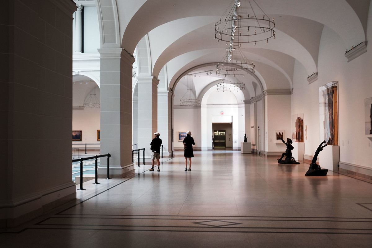 People walk through the galleries of the Brooklyn Museum on May 20th, 2016.