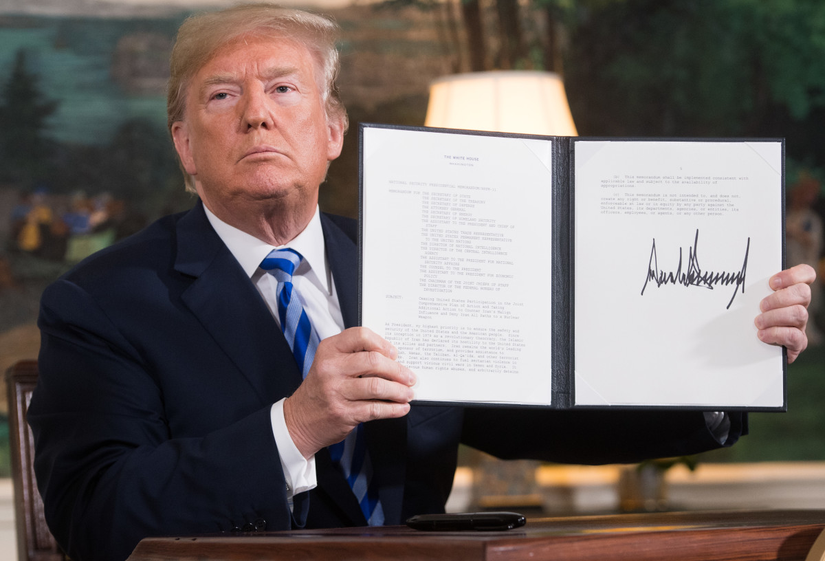 President Donald Trump signs a document reinstating sanctions against Iran after announcing the U.S. withdrawal from the Iran nuclear deal at the White House on May 8th, 2018.