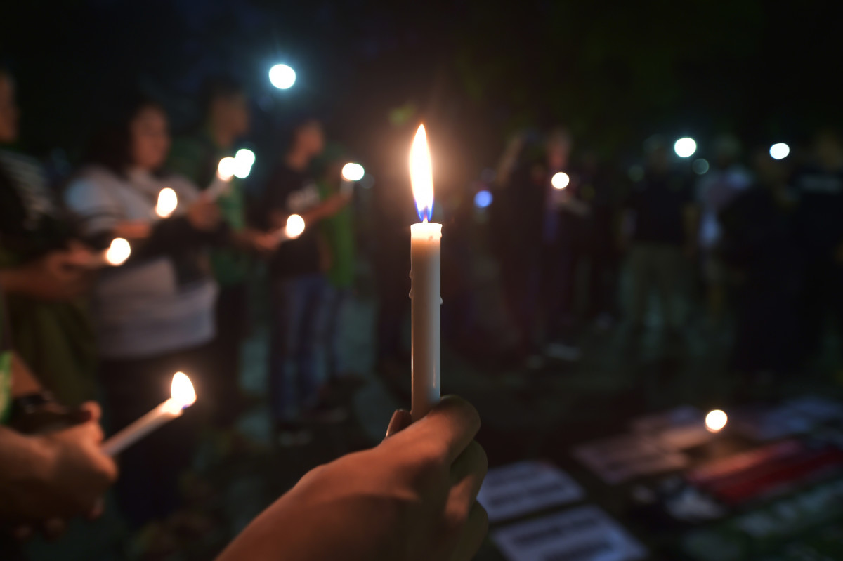 Indonesian people take part in a candlelight vigil in support of the victims and their relatives following a series of bomb attacks in Surabaya, in Jakarta, on May 14th, 2018. A family of five, including a child, carried out the suicide bombing of a police headquarters in Indonesia, police said, a day after a deadly wave of attacks on churches staged by another family.