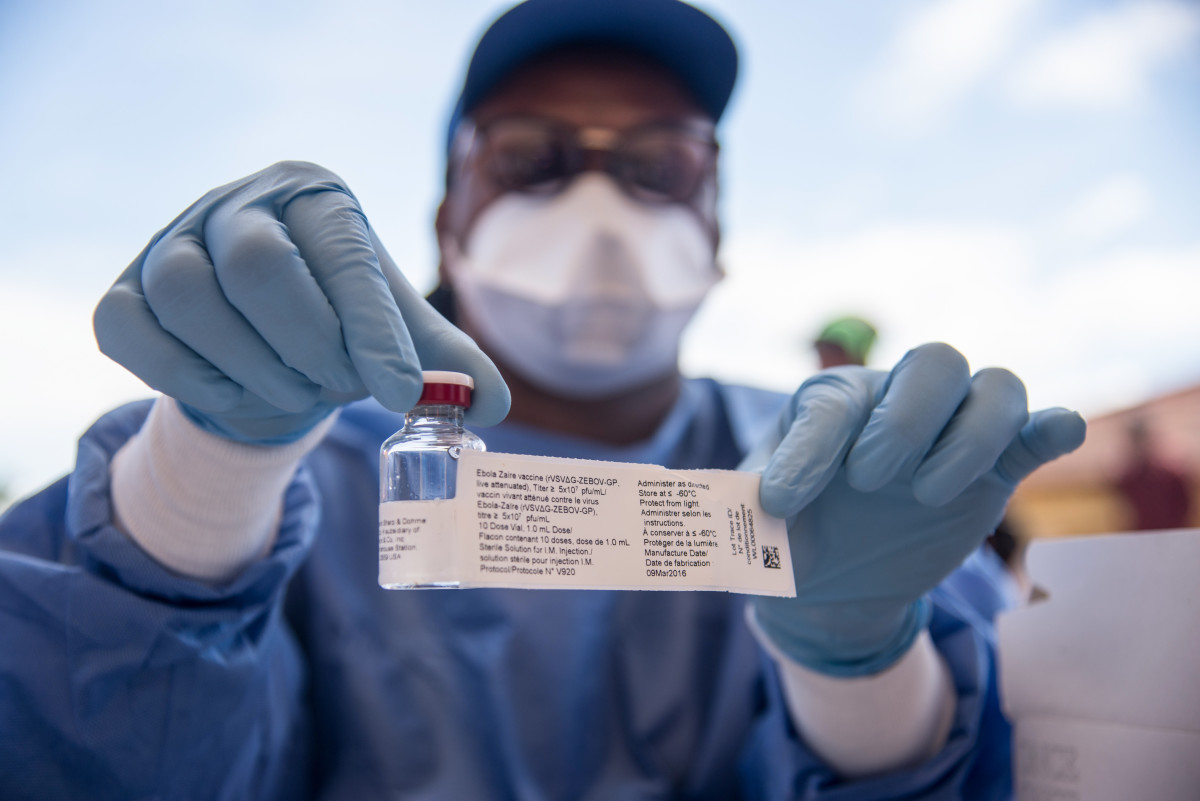 A nurse working with the World Health Organization shows a bottle containing Ebola vaccine at the town hall of Mbandaka on May 21st, 2018, during the launch of the Ebola vaccination campaign. The death toll in an outbreak of Ebola in the Democratic Republic of Congo rose to 26 on May 21st, 2018, after a person died in the northwest city of Mbandaka, as the government began vaccinating first responders against the dreaded disease.