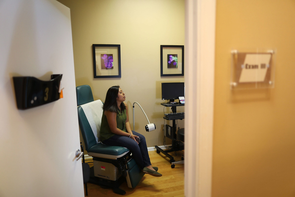 A woman sits in the exam room at a Planned Parenthood health center on in West Palm Beach, Florida.