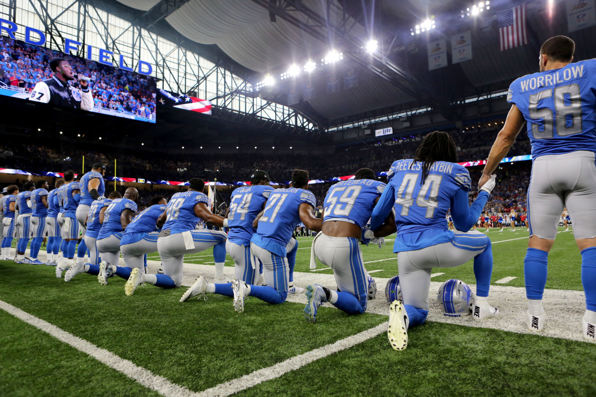 Members of the Detroit Lions take a knee during the playing of the national anthem at Ford Field on September 24th, 2017, in Detroit, Michigan.