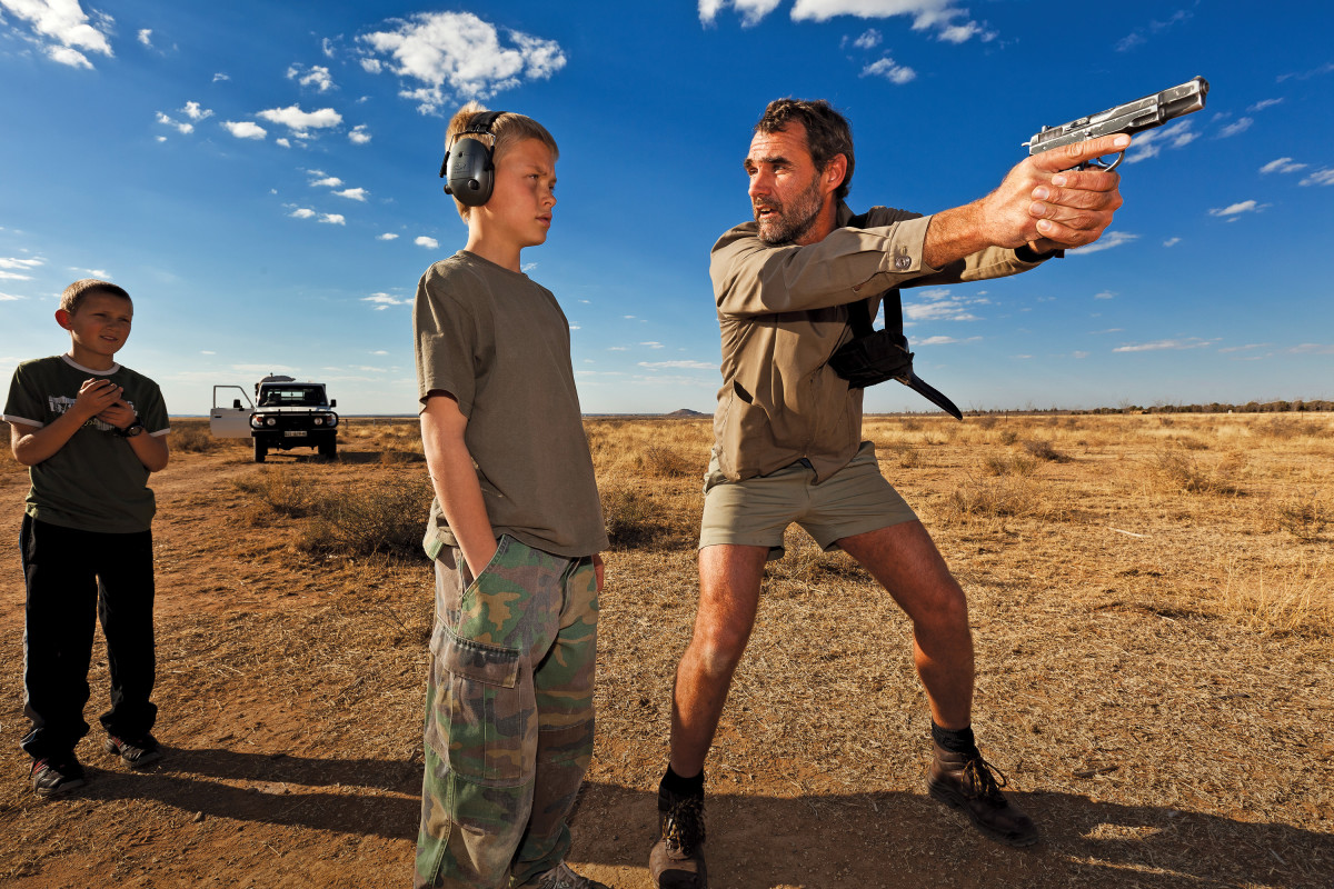 Orania, South Africa: Niklas Kirsten, a former paratrooper in the South African Army, instructs Erik Du Pree on handgun self-defense in the fields outside an ultra-conservative, all-Afrikaner stronghold known as Orania.
