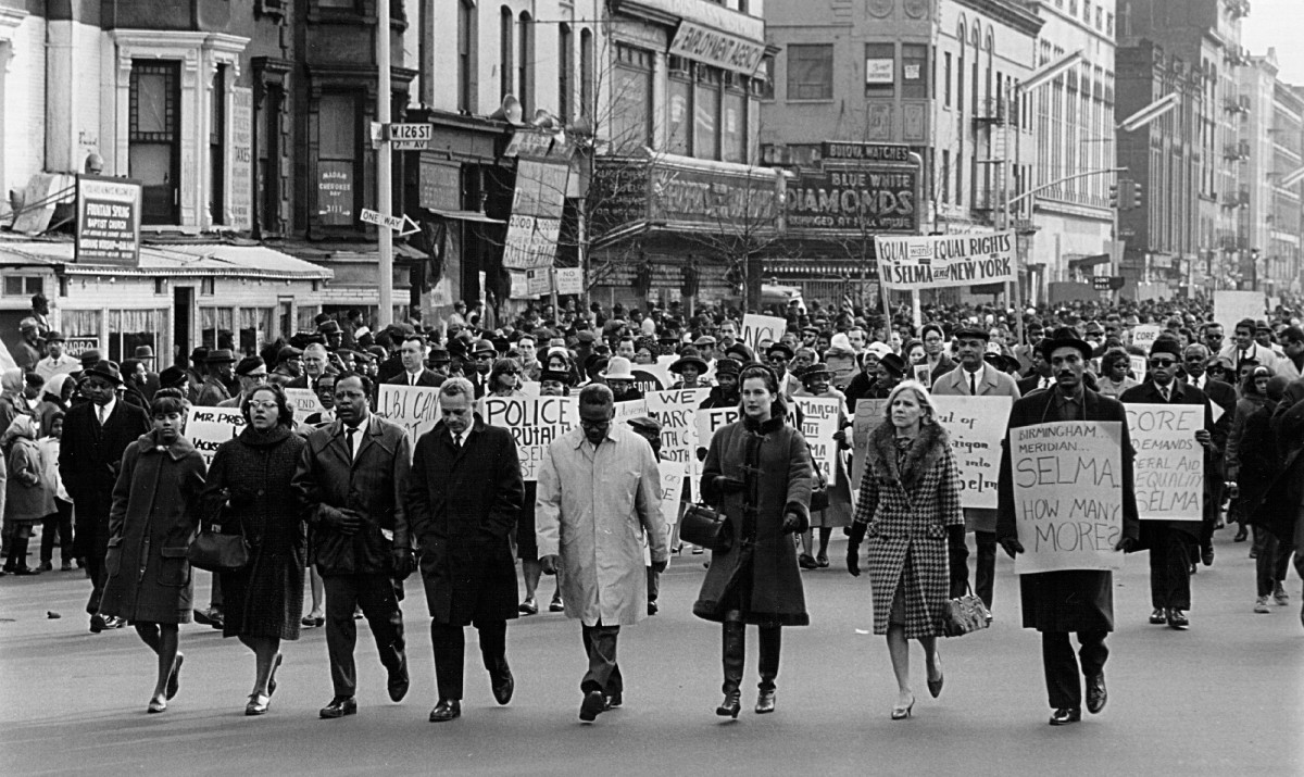 Civil rights advocates march in the Harlem section of New York to protest racial violence in Alabama on March 16th, 1965.