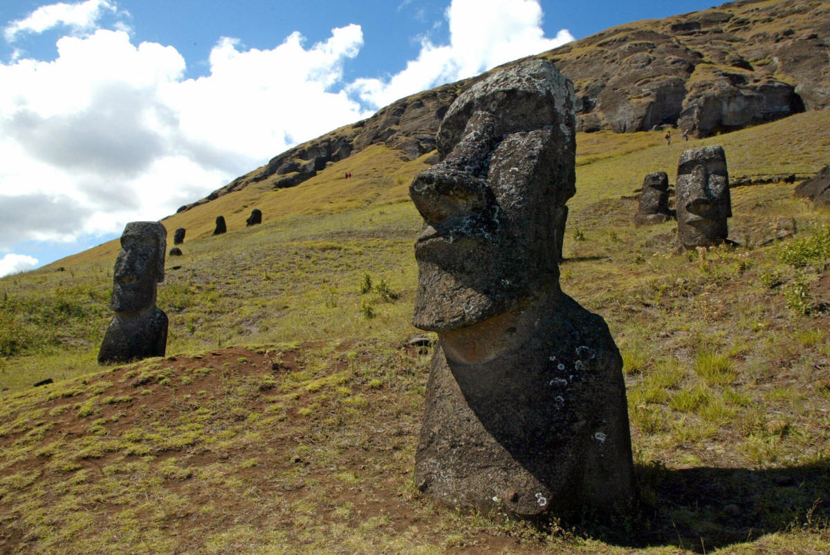 Some of the 390 abandoned huge statues in the hillside of the Rano Raraku volcano on Easter Island.