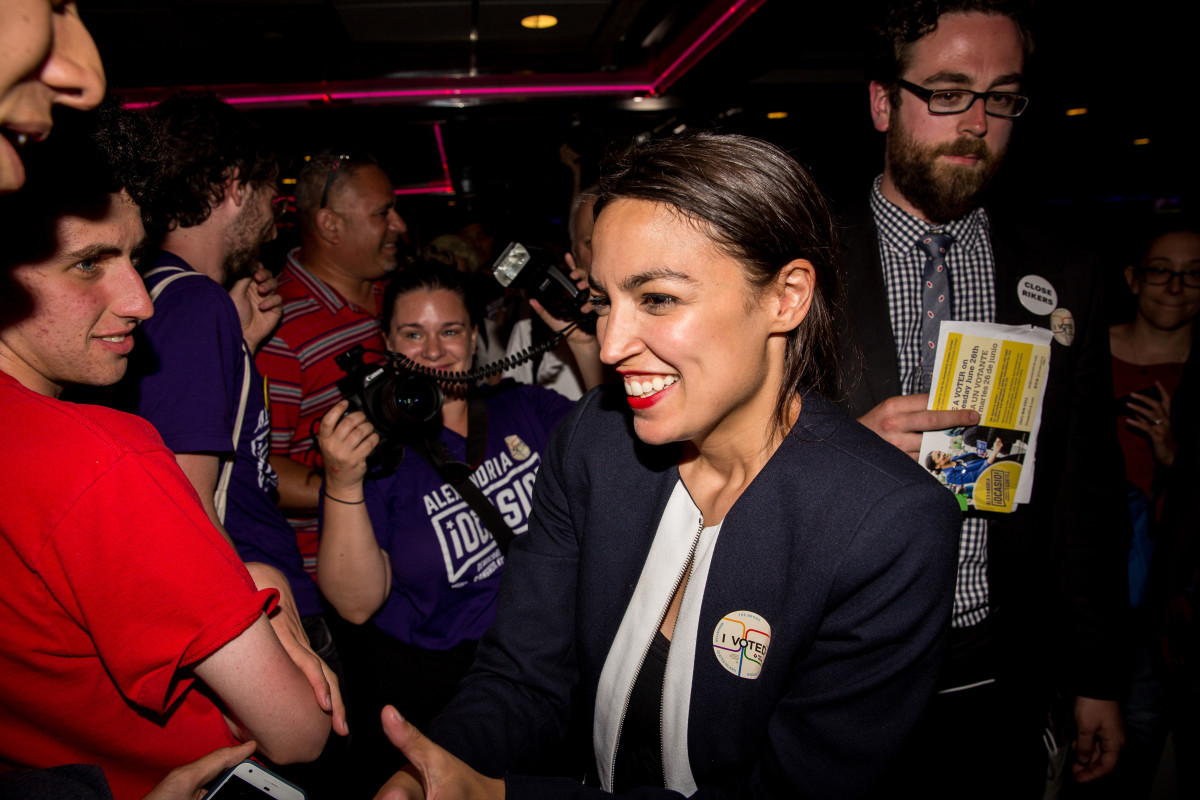 Alexandria Ocasio-Cortez celebrates with supporters at a victory party after upsetting incumbent Democratic Representative Joseph Crowley on June 26th, 2018, in New York City.