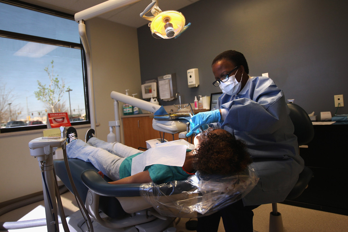A dental hygienist at a community health center.