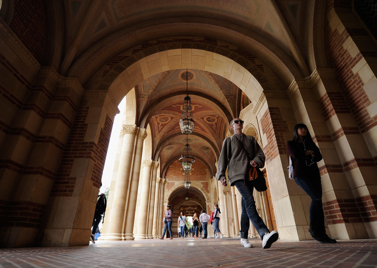 Students walk near Royce Hall on the University of California–Los Angeles campus in Los Angeles, California.