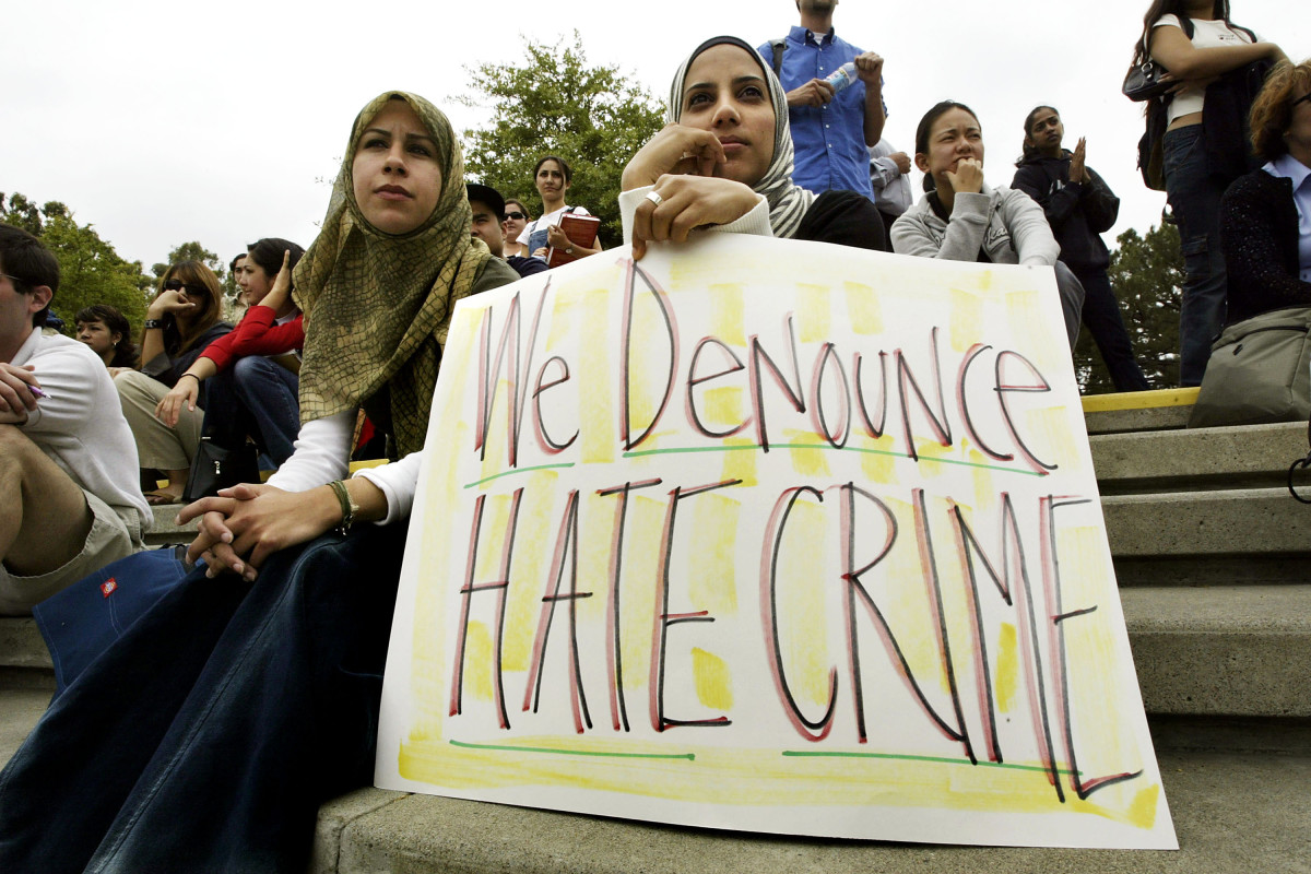 Zeena Sabri (left) and Rima Karuf join members of the Society of Arab Students at the University of California–Irvine to protest the destruction of a cardboard wall that was supposed to portray the security wall built to keep Palestinian suicide bombers out of Israel on May 27th, 2004, in Irvine, California.