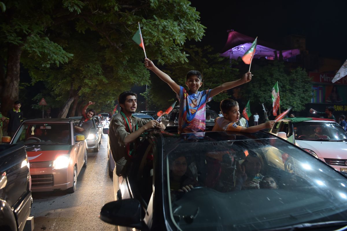 Supporters of Pakistan's cricketer-turned politician Imran Khan, head of the Pakistan Tehreek-e-Insaf (Movement for Justice) Party, celebrate on a street during the general election in Islamabad on July 25th, 2018. Pakistan's incumbent party rejected early election results Thursday that suggested Khan was on his way to becoming the country's next prime minister, alleging "blatant" rigging.