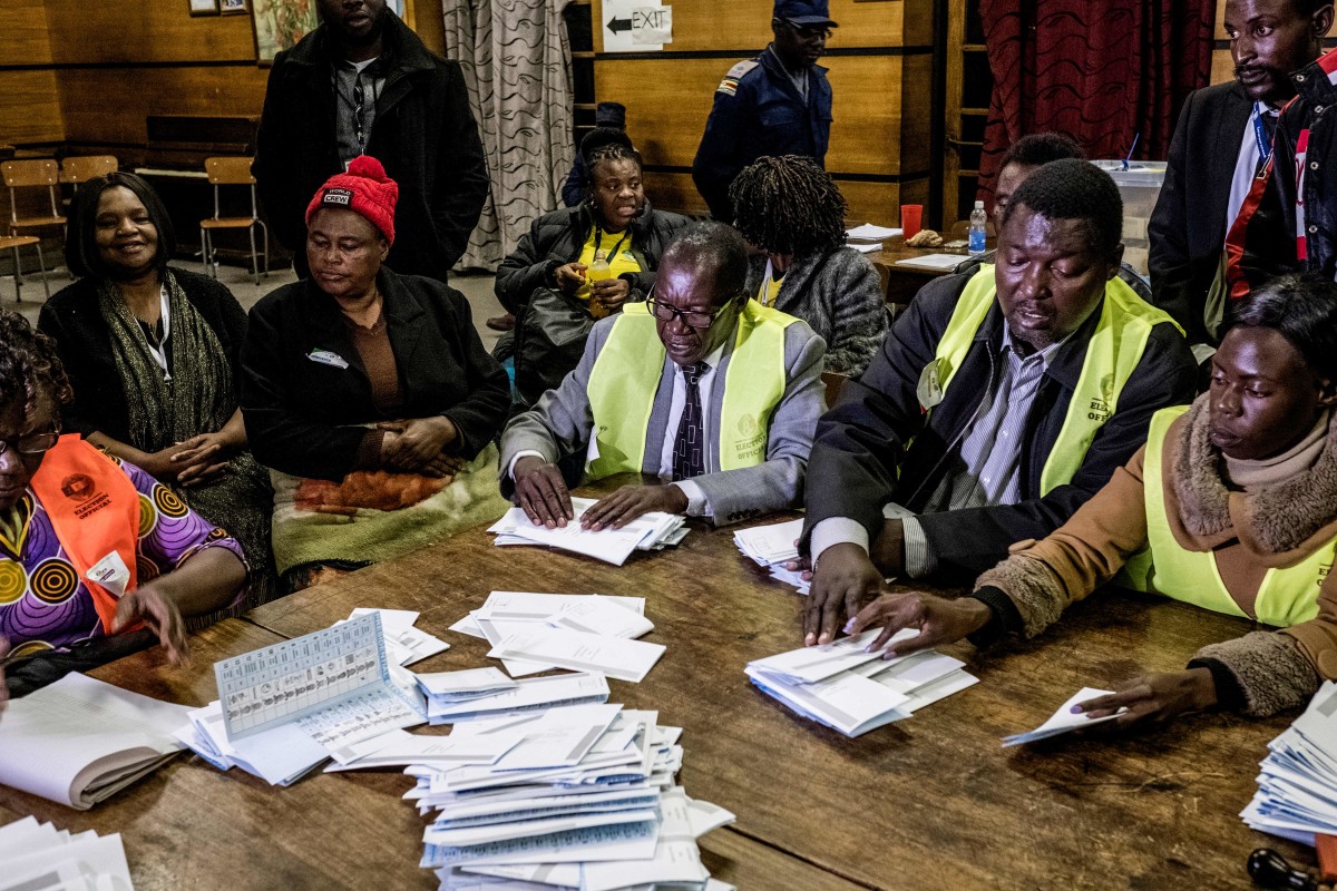 Election officials tally presidential candidates' ballots during counting operations for Zimbabwe's general election at the David Livingston primary school in central Harare on July 30th, 2018. Voting closed in Zimbabwe's first election since the former president was ousted after 37 years in power as observers warned of possible shortcomings in July 30th's landmark poll.