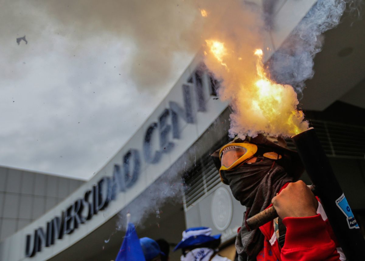 A student fires a homemade mortar during a protest in which students from different universities from across Nicaragua gathered to demand President Daniel Ortega and his powerful vice president, wife Rosario Murillo, resign, and for government to keep the 6 percent budget for universities, in Managua, on August 2nd, 2018.