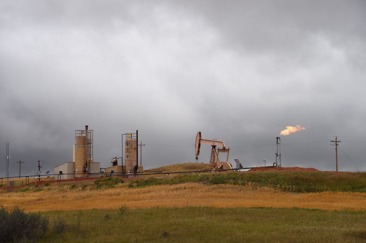 Pump jacks and a gas flare are seen near Williston, North Dakota, on September 6th, 2016.
