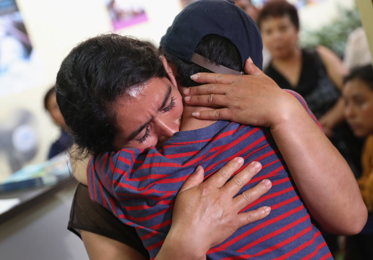 Isidra Larena Calderon hugs her son Jonathan Leonardo on August 7th, 2018 in Guatemala City, Guatemala, as the two are reunited months after U.S. border agents separated them.