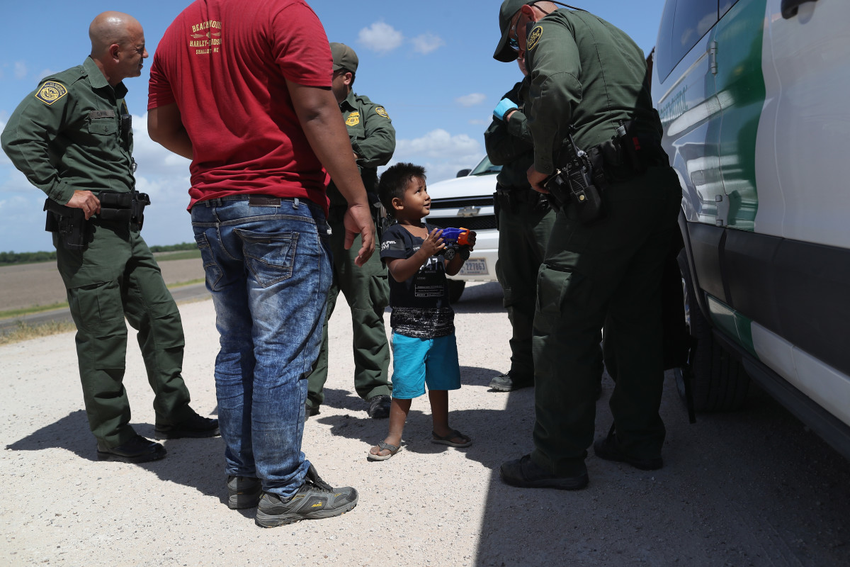A boy is taken into custody by U.S. Border Patrol agents near the U.S.-Mexico Border on June 12th, 2018, near Mission, Texas.