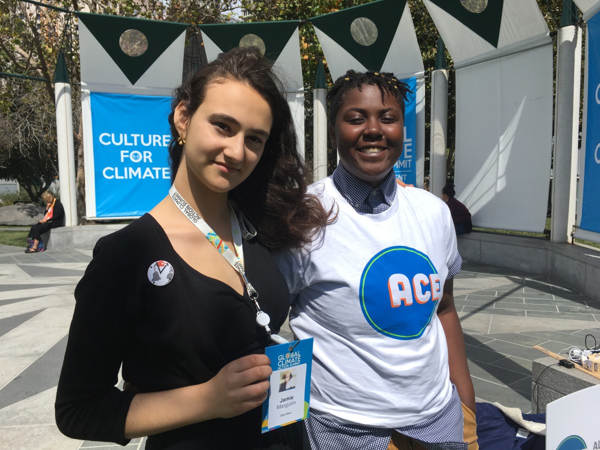 Jamie Margolin (left) with Vic Barrett, a fellow plaintiff suing the government over climate change, outside the Global Climate Action Summit in San Francisco this week.