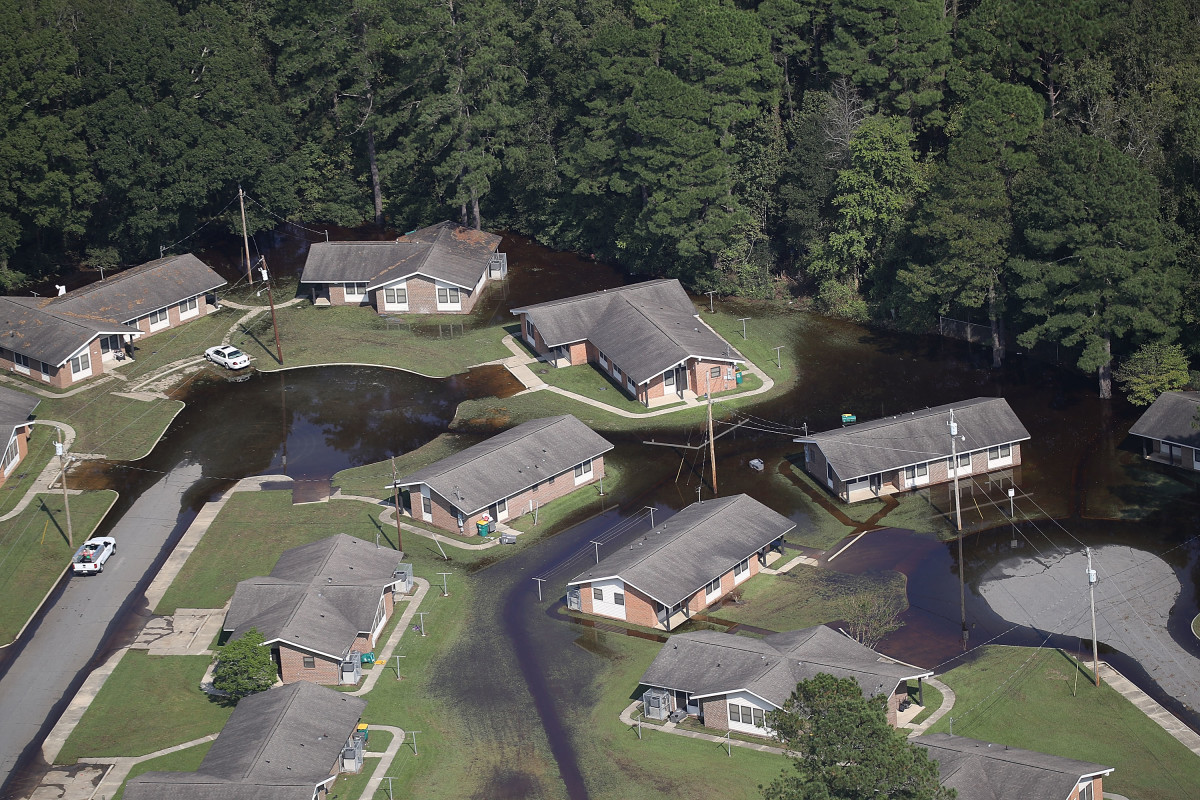 Flood waters are seen surrounding homes after heavy rains from Hurricane Florence on September 20th, 2018, in Lumberton, North Carolina.