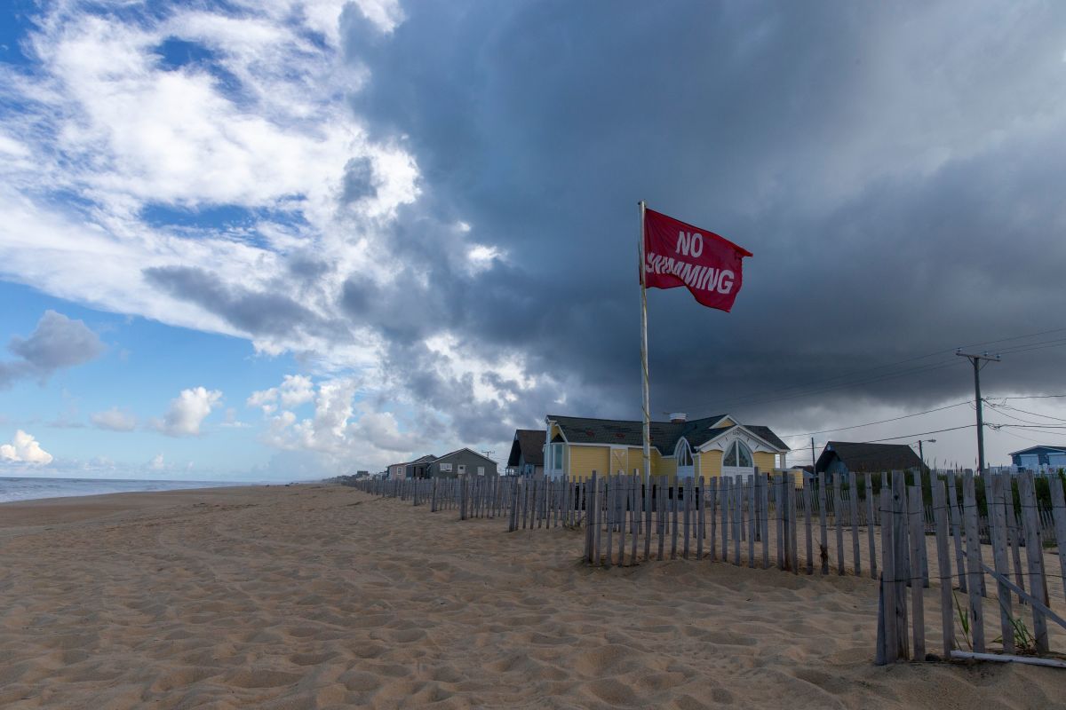 A No Swimming flag flies on the beach in Kill Devil Hills in the Outer Banks of North Carolina.
