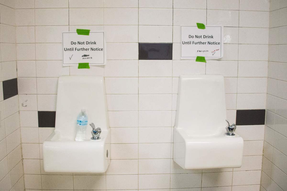 Placards warn against drinking from the water fountains at Flint Northwestern High School in Flint, Michigan, on May 4th, 2016.