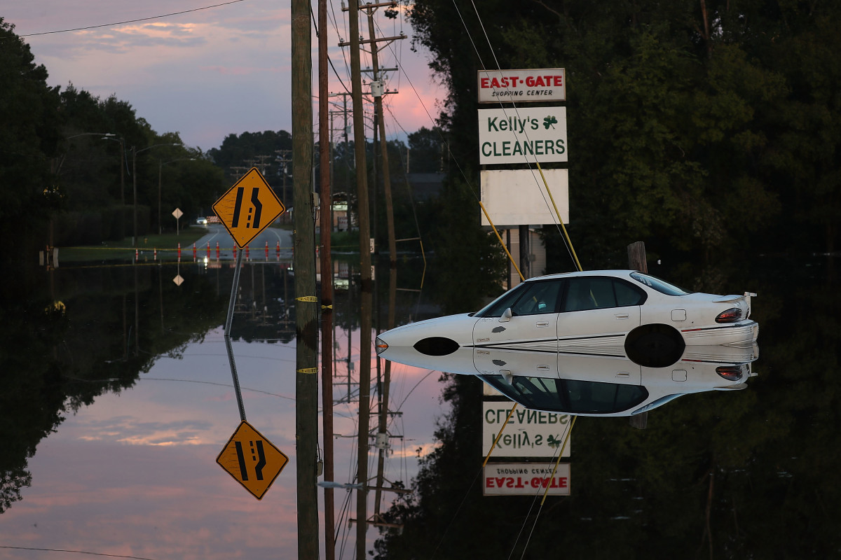 A car sits in a flooded parking lot on September 18th, 2018, in Fayetteville, North Carolina.