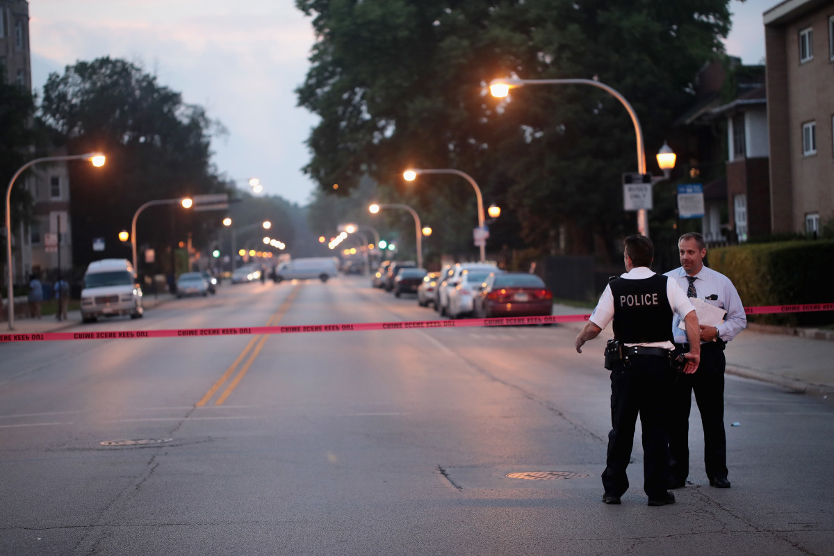 Police investigate a scene where two people were shot on July 16th, 2018, in Chicago, Illinois.