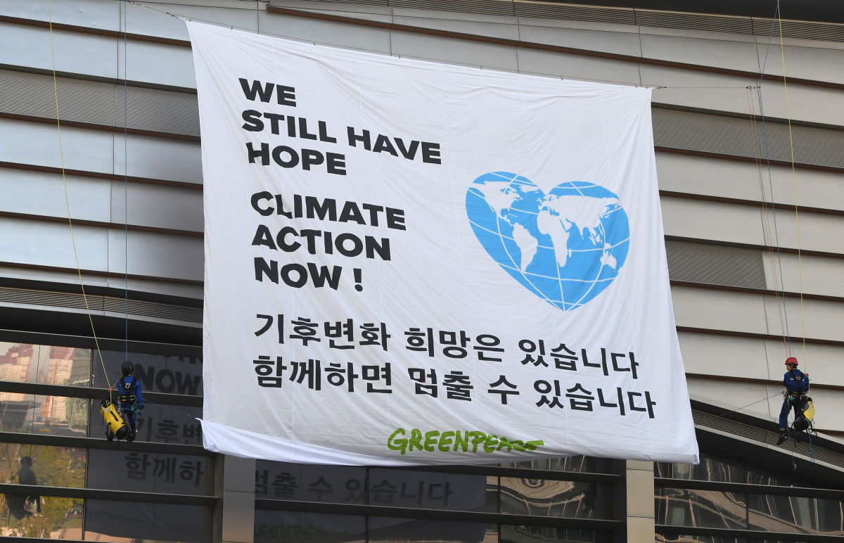 Greenpeace activists display a banner at a rally during a meeting of the Intergovernmental Panel for Climate Change in Incheon, South Korea, on October 8th, 2018.