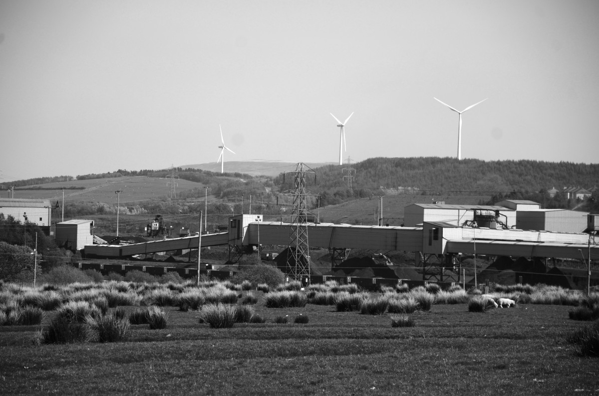 A wind farm looms over the coal washery at Onllwyn, Wales.