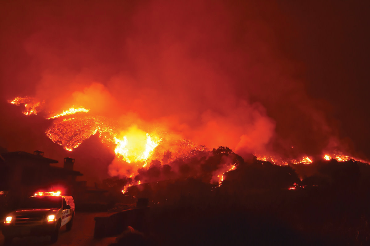 Santa Barbara County Fire Department's Mike Eliason captured flames above a Montecito neighborhood on Bella Vista Drive on December 12th, 2017.