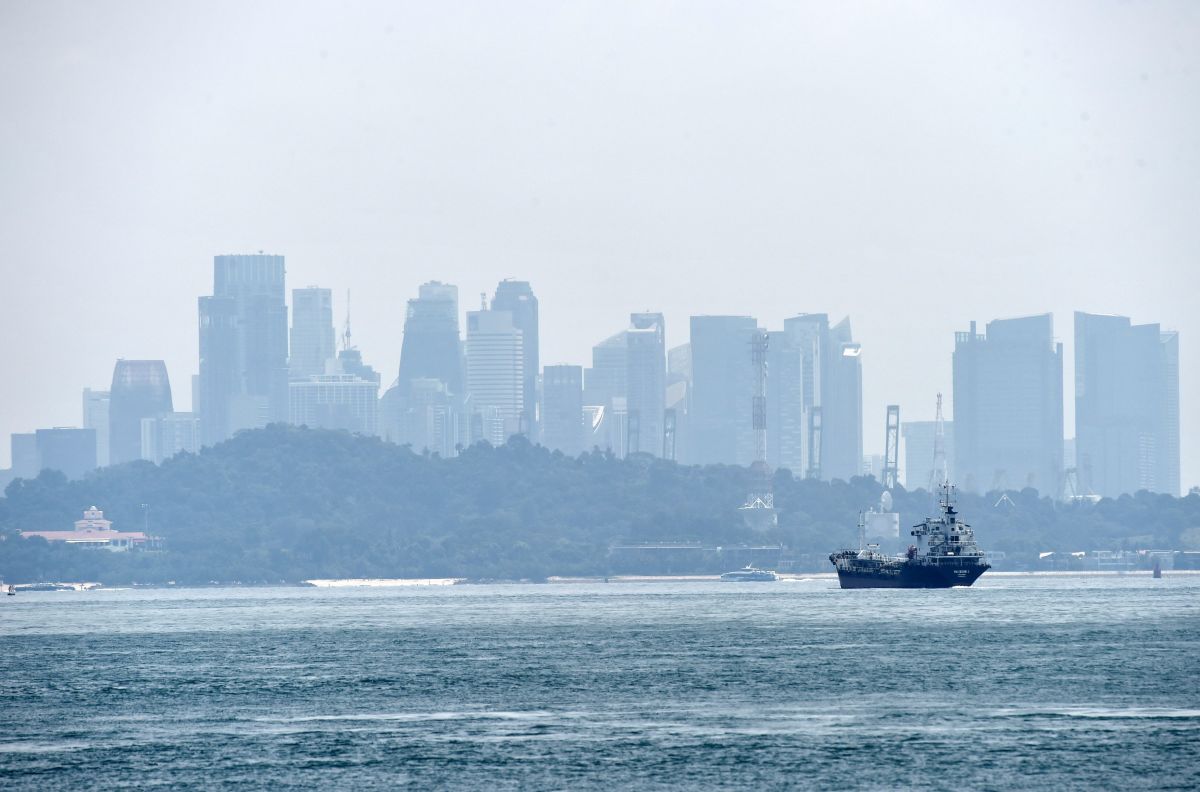 A general view of hazy Singapore skyline is seen from the southern straits of Singapore on September 14th, 2017.