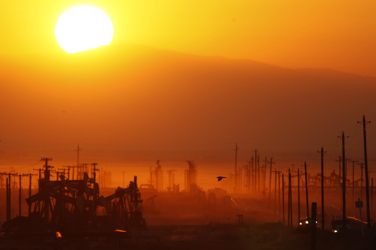 The sun rises over an oil field over the Monterey Shale formation where gas and oil extraction using hydraulic fracturing, or fracking, is on the verge of a boom on March 24th, 2014, near Lost Hills, California.