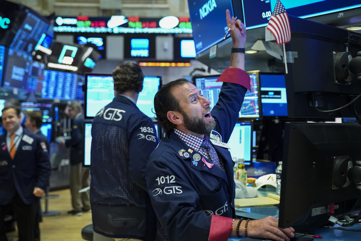 Traders work at the opening bell on the floor of the New York Stock Exchange on October 12th, 2018, in New York City. The Dow Jones Industrial Average jumped over 400 points at Friday's open, following two days of steep losses.