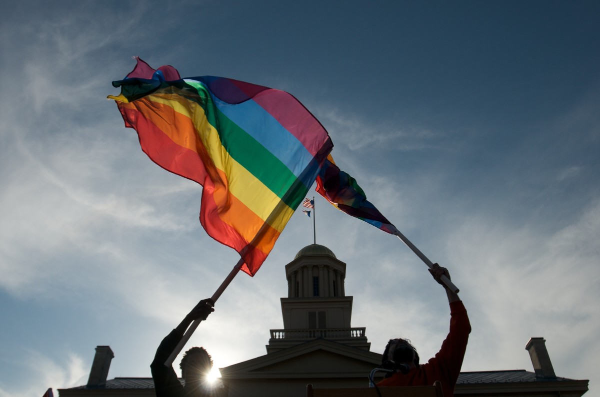 Gay, lesbian and transgender activists react to the unanimous decision by the Iowa Supreme Court earlier in the day recognizing same sex marriage as a civil right during a celebration on April 3, 2009 at the University of Iowa in Iowa City, Iowa.