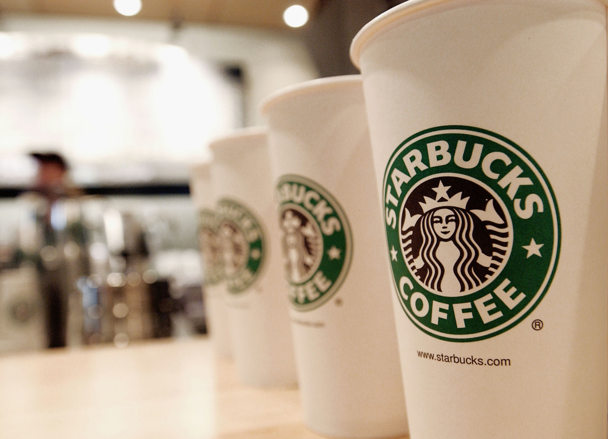 Beverage cups featuring the logo of Starbucks Coffee are seen in the new flagship store on 42nd Street August 5, 2003 in New York City. The Seattle-based coffee company has emerged as the largest food chain in the Manhattan borough of New York with 150 outlets.