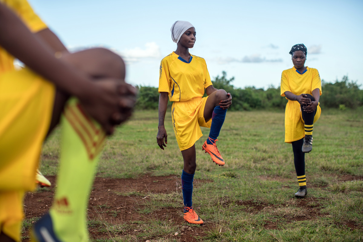 Jumbi, Zanzibar, Tanzania: The Green Queens warm up ahead of a match. Men on the island have long resisted women's presence on the field, but a small cadre is challenging traditional gender norms.